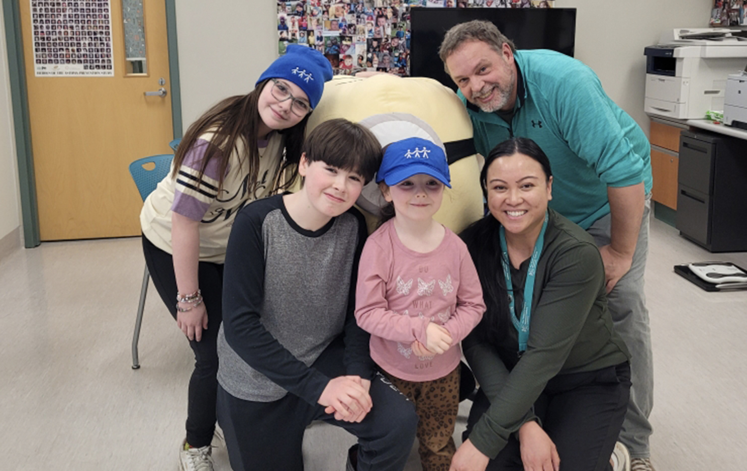 Manitoba: Cedric (front left) with family & staff at his 13-year visit