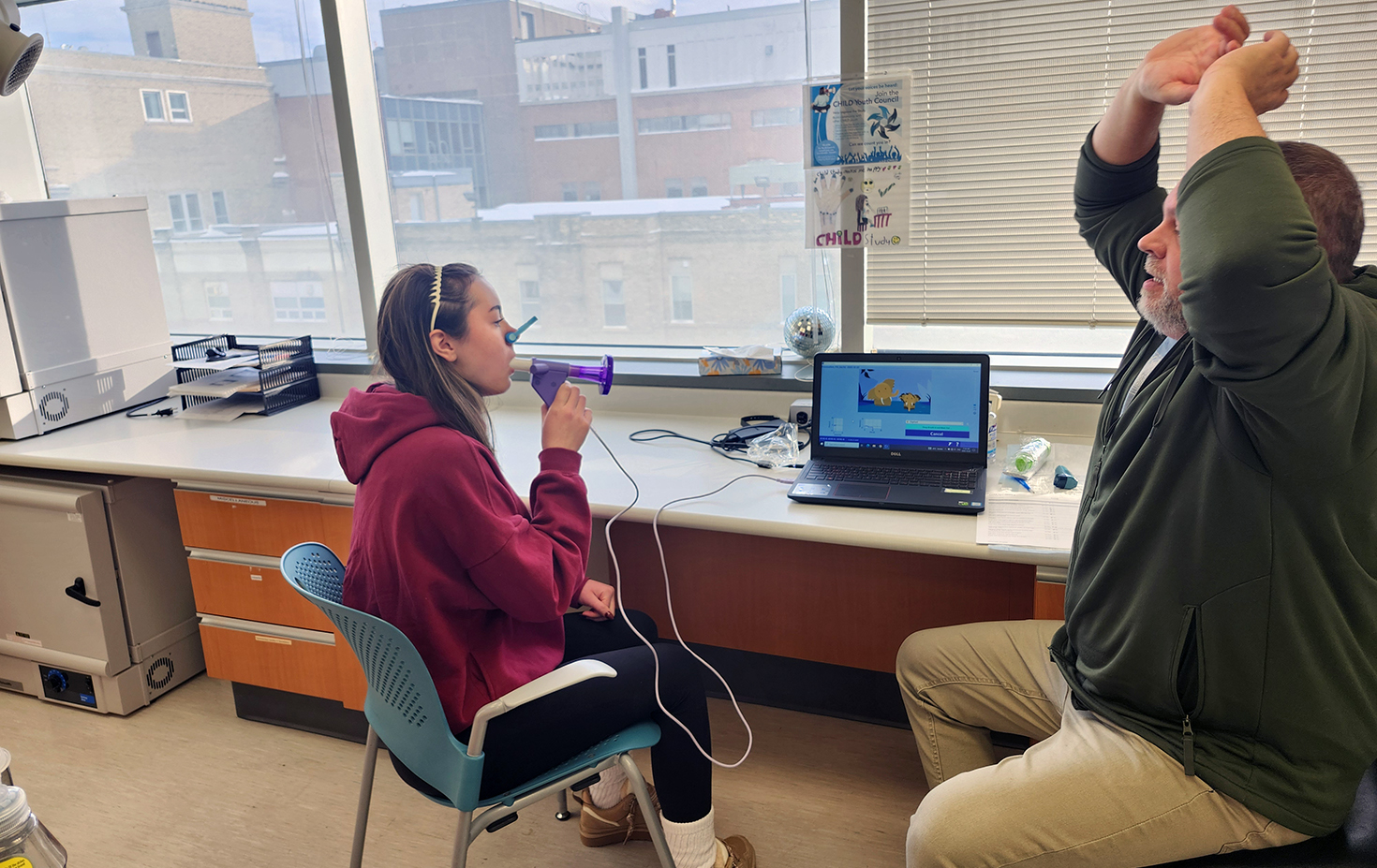 Manitoba: Naomi performs a spirometry test at her 16-year visit